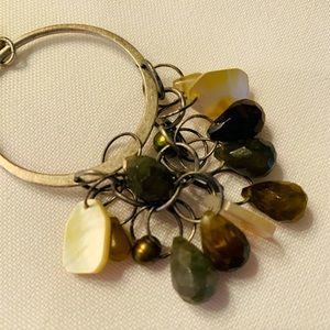 Lia Sophia Suede Necklace with several charms on silver matte loop